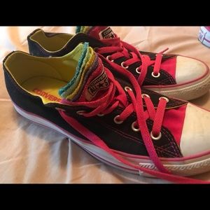 Black Chuck Taylors with multi color tongue